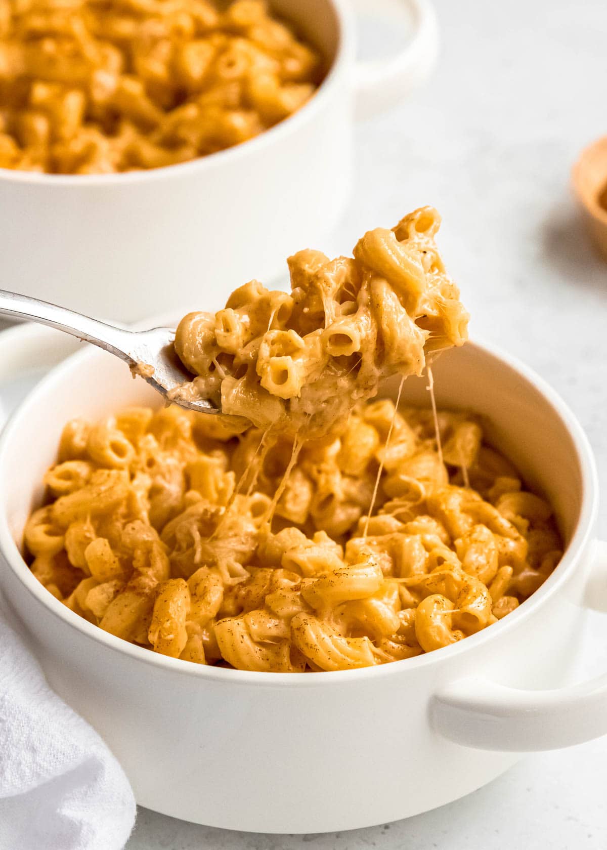 cheese shot of mac and cheese in a bowl with a spoon