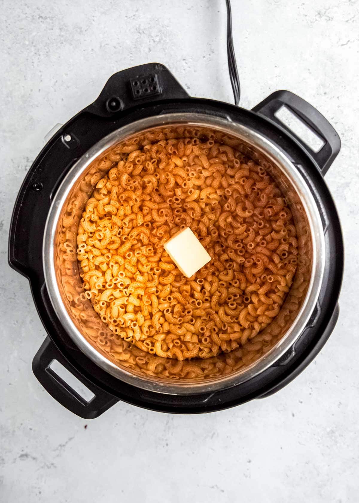 butter added to instant pot and cooked noodles