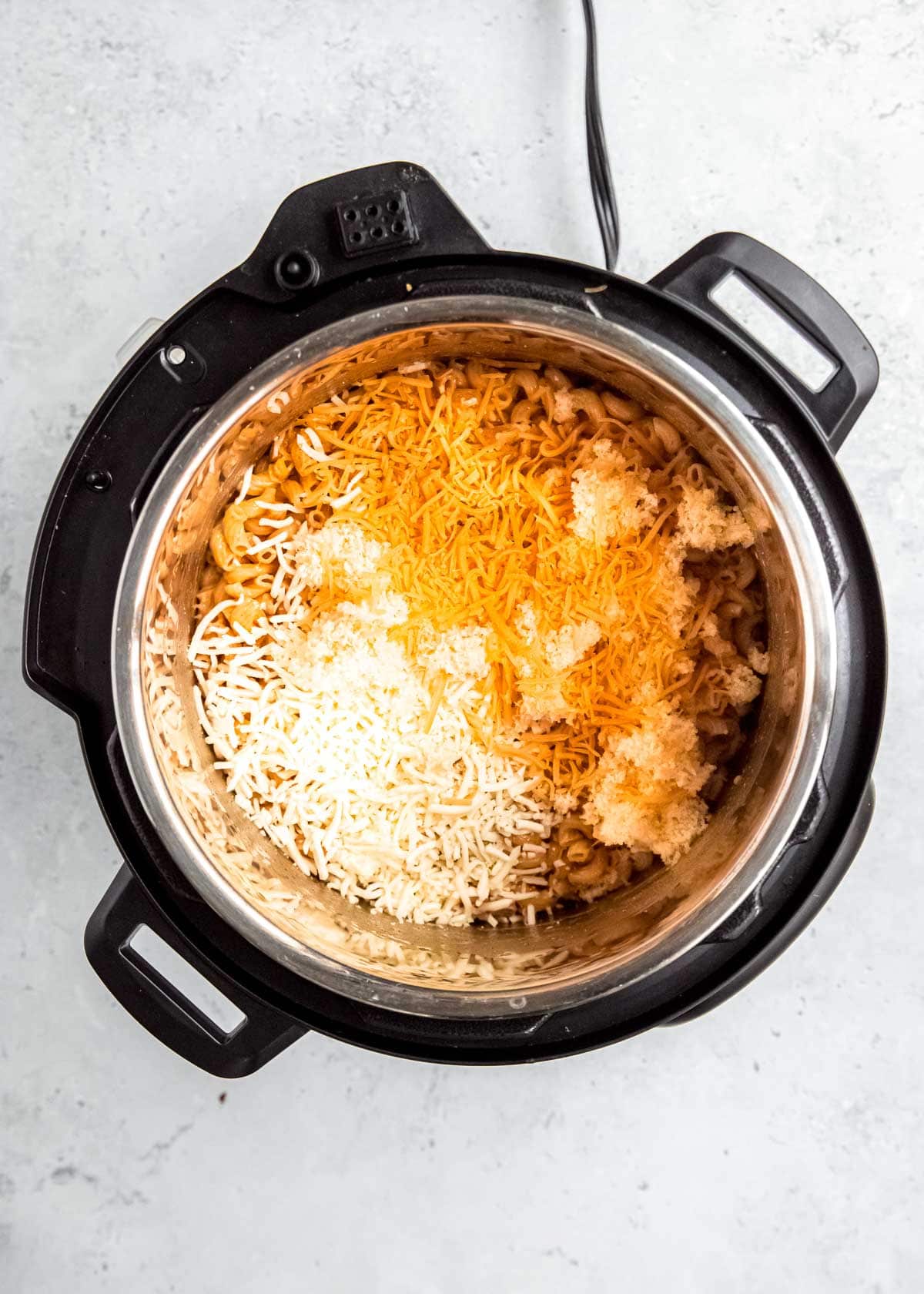 shredded cheese and noodles in instant pot