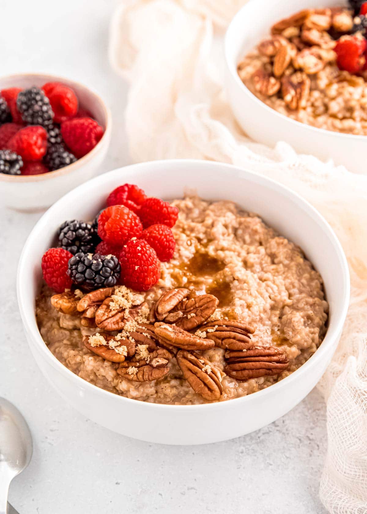 steel cut oatmeal in bowl with nuts and berries