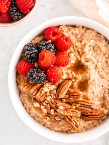 bowl of steel cut oats with pecans and fruit