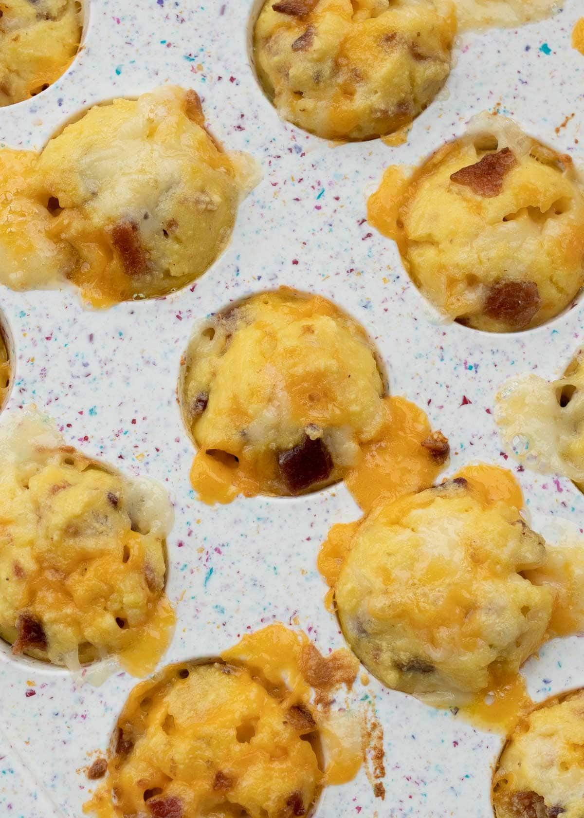 overhead shot of cooked egg bites in silicone muffin pan