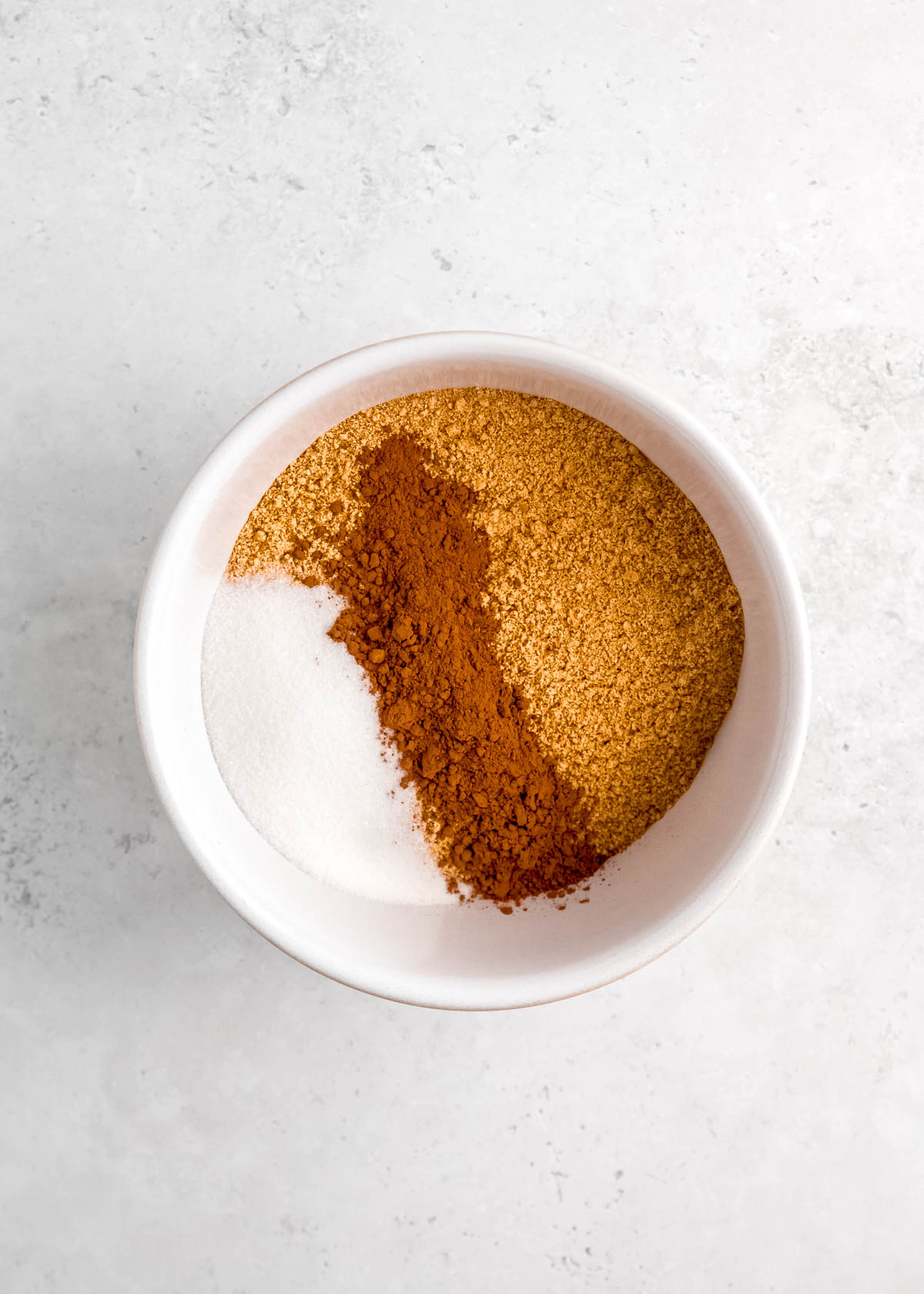 combine cocoa powder, sugar, and graham cracker crumbs