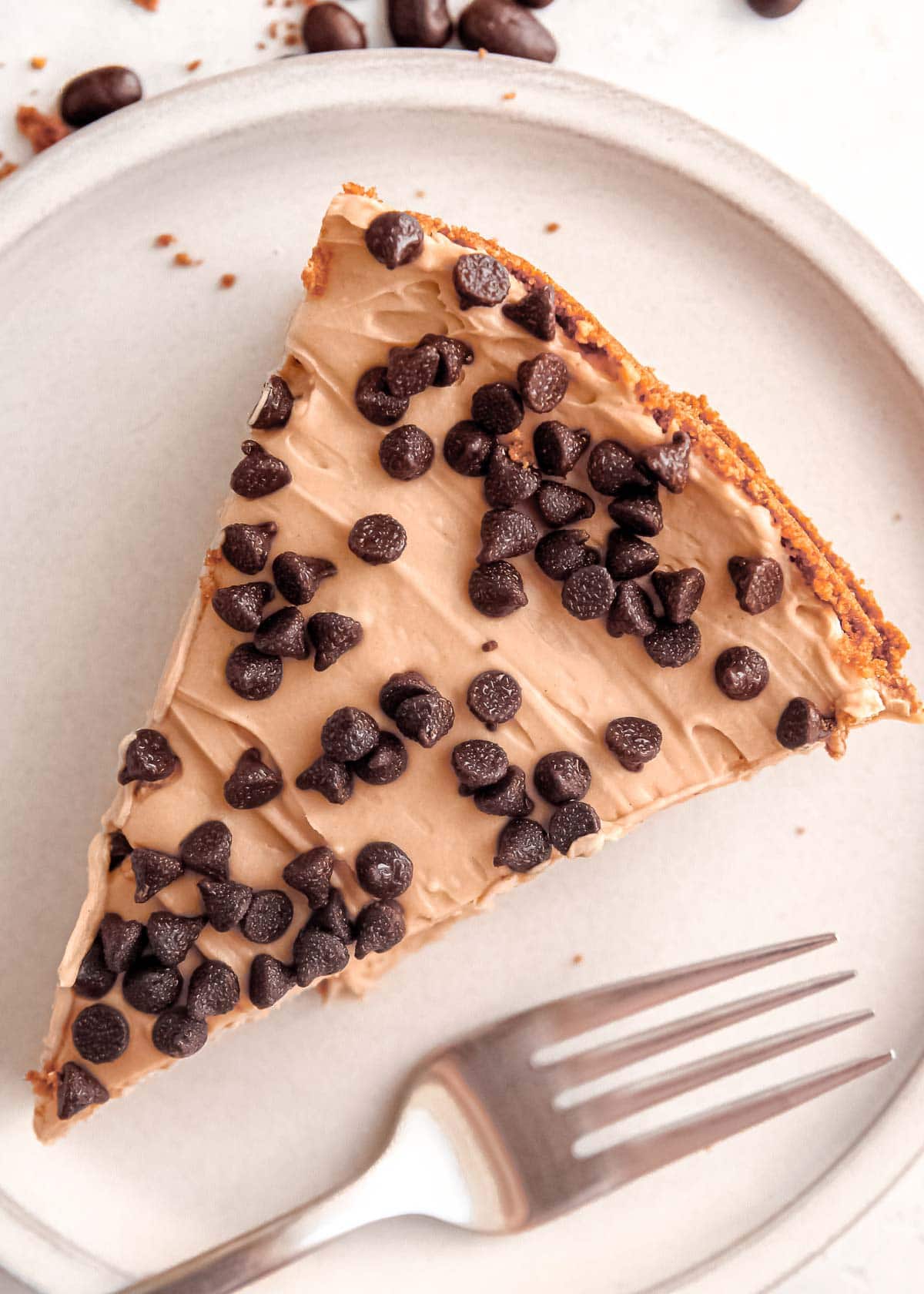 a slice of no bake mocha cheesecake on a plate with a fork