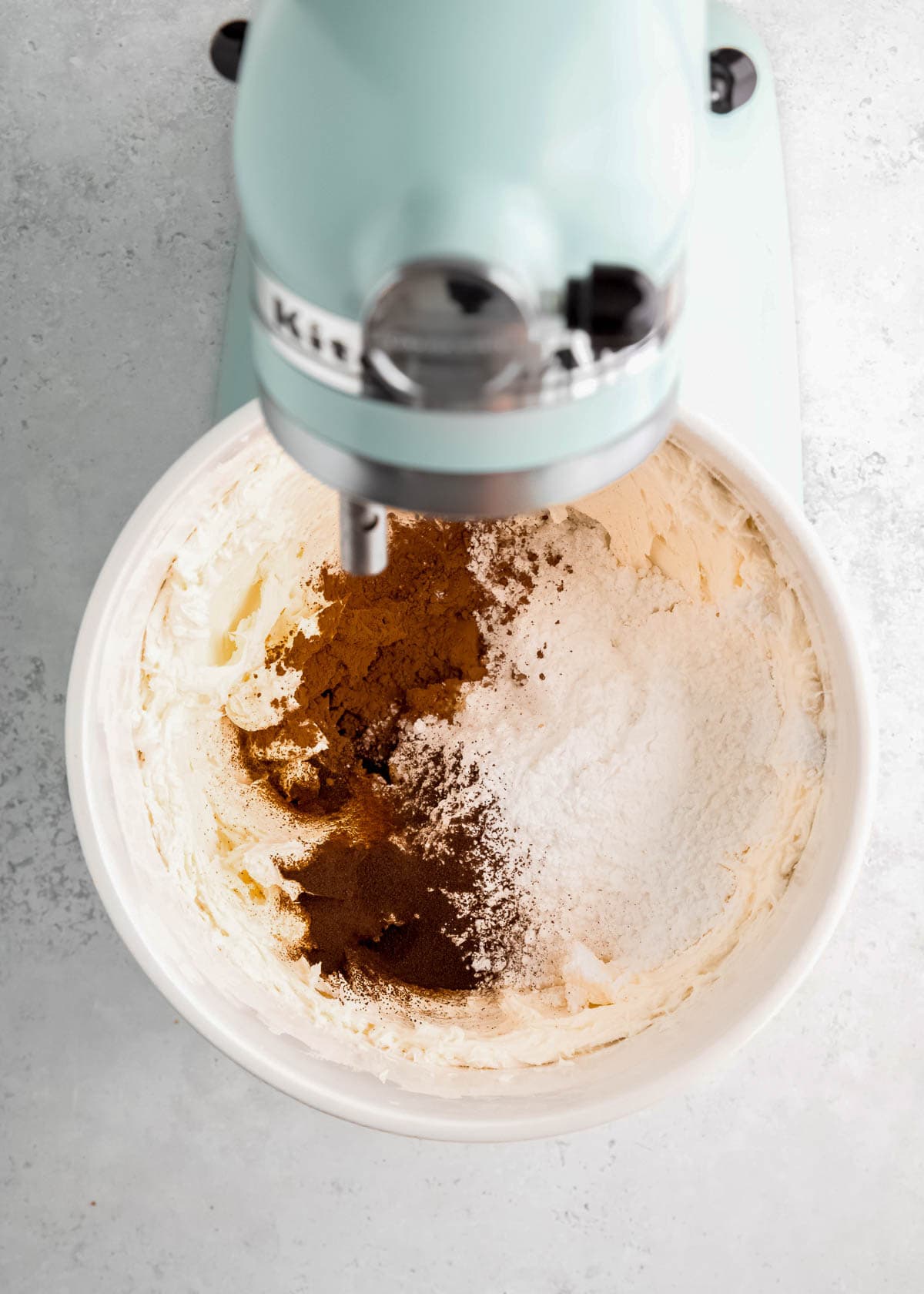mix in cocoa and espresso powders, powdered sugar, and vanilla extract to beaten cream cheese