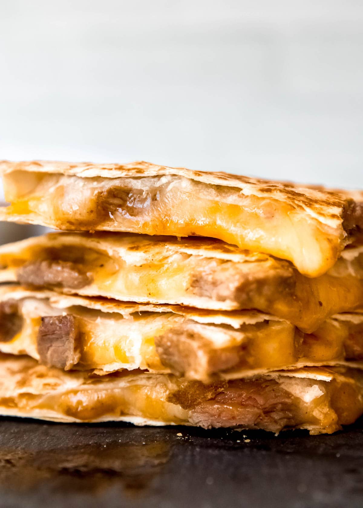 steak quesadillas on gray background 