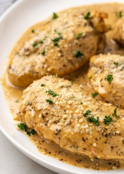 instant pot chicken breast on plate with sauce