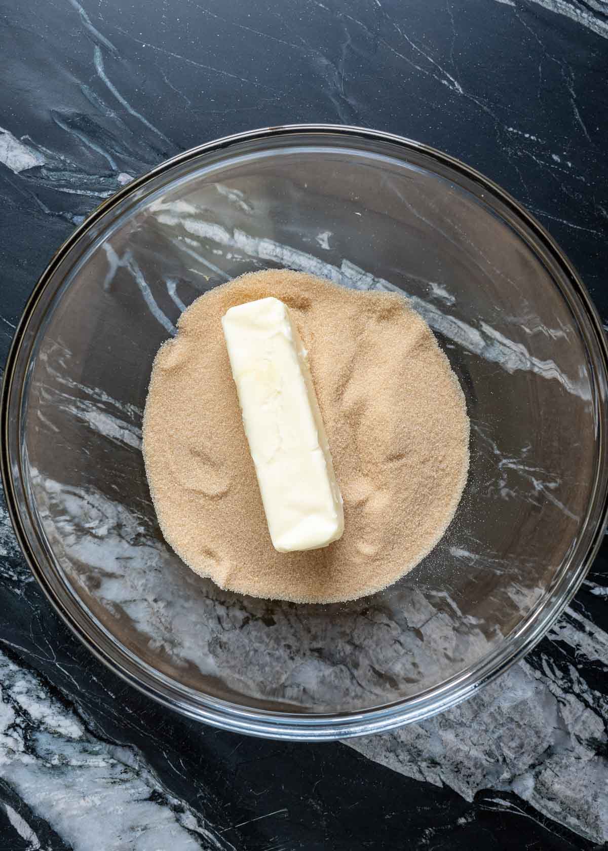 butter on a mound of brown sugar monk fruit in a glass bowl