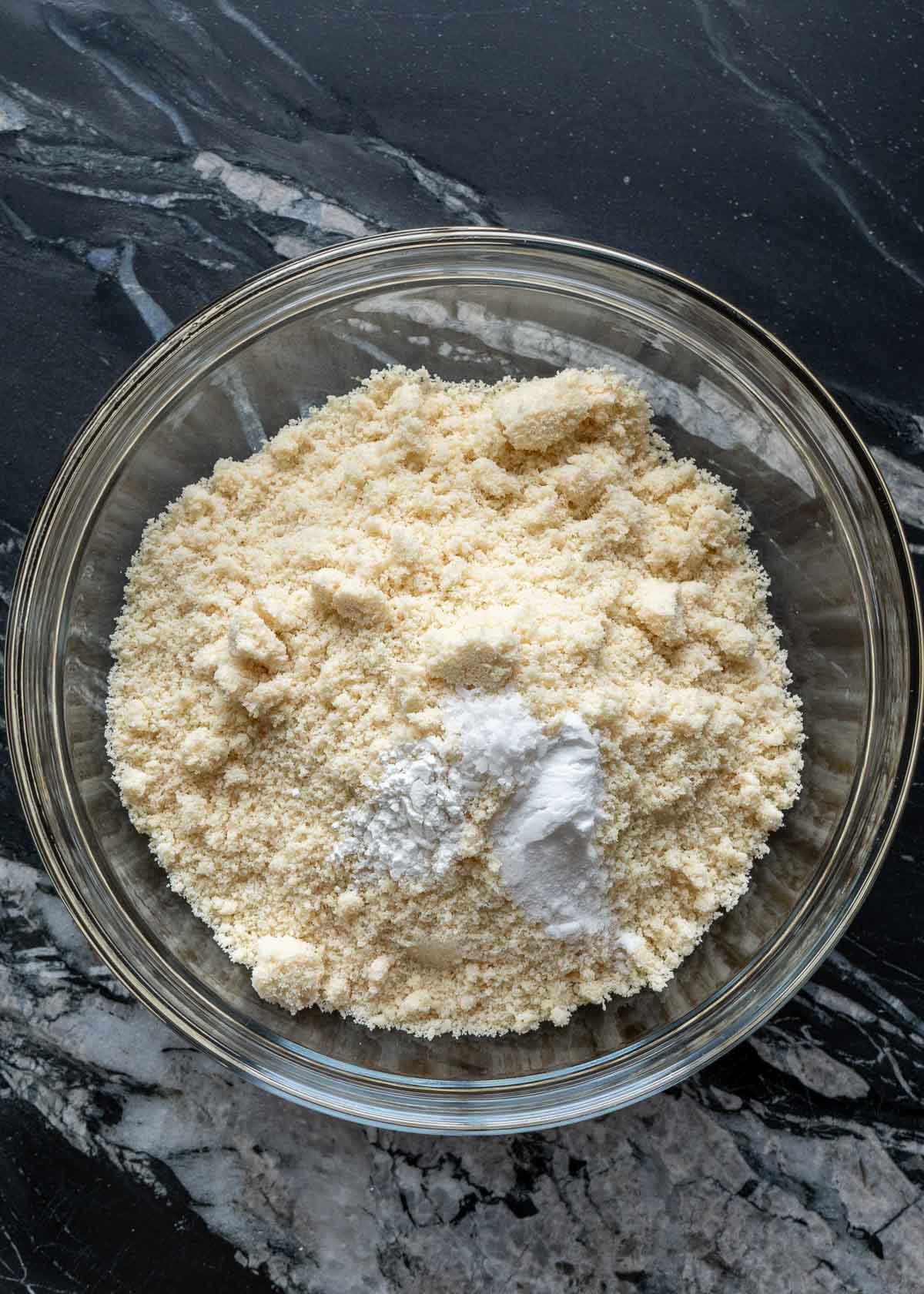 almond flour, baking soda, baking powder, and salt in a glass bowl