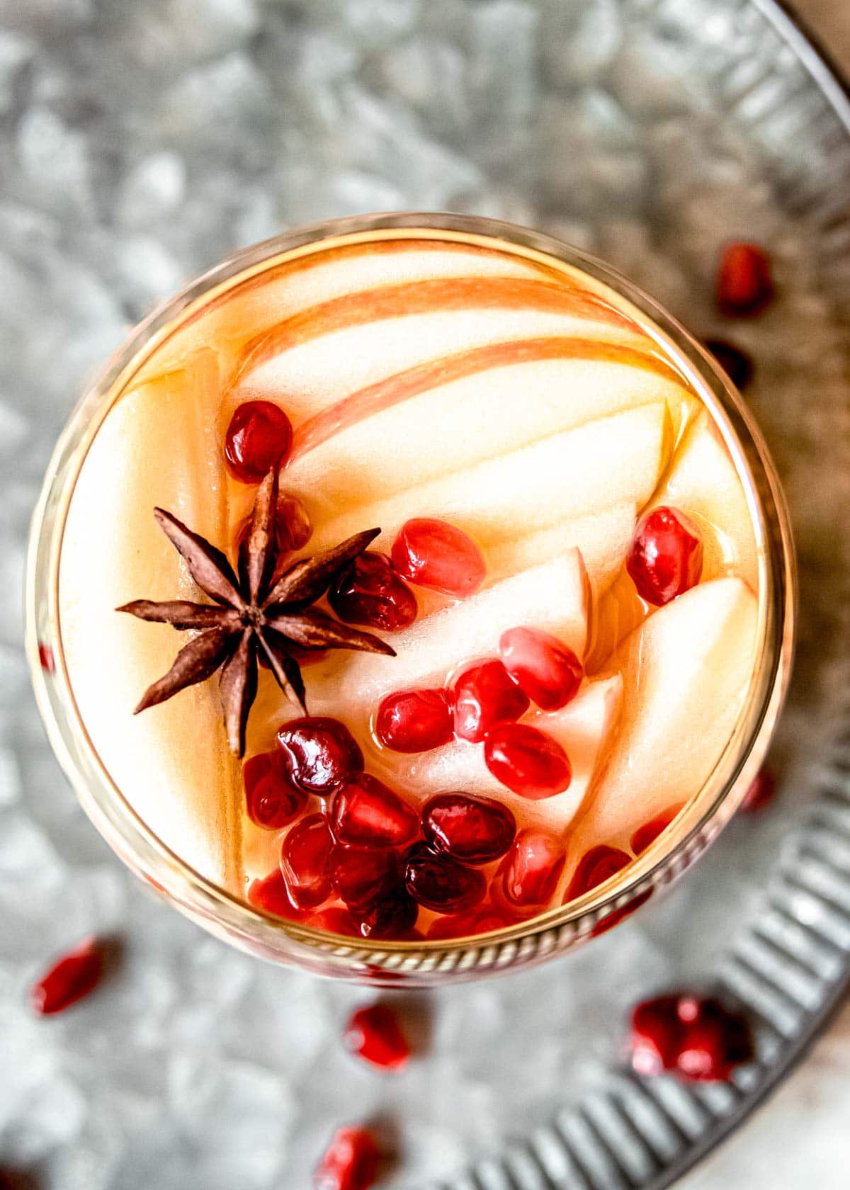 glass of apple cider sangria overhead shot