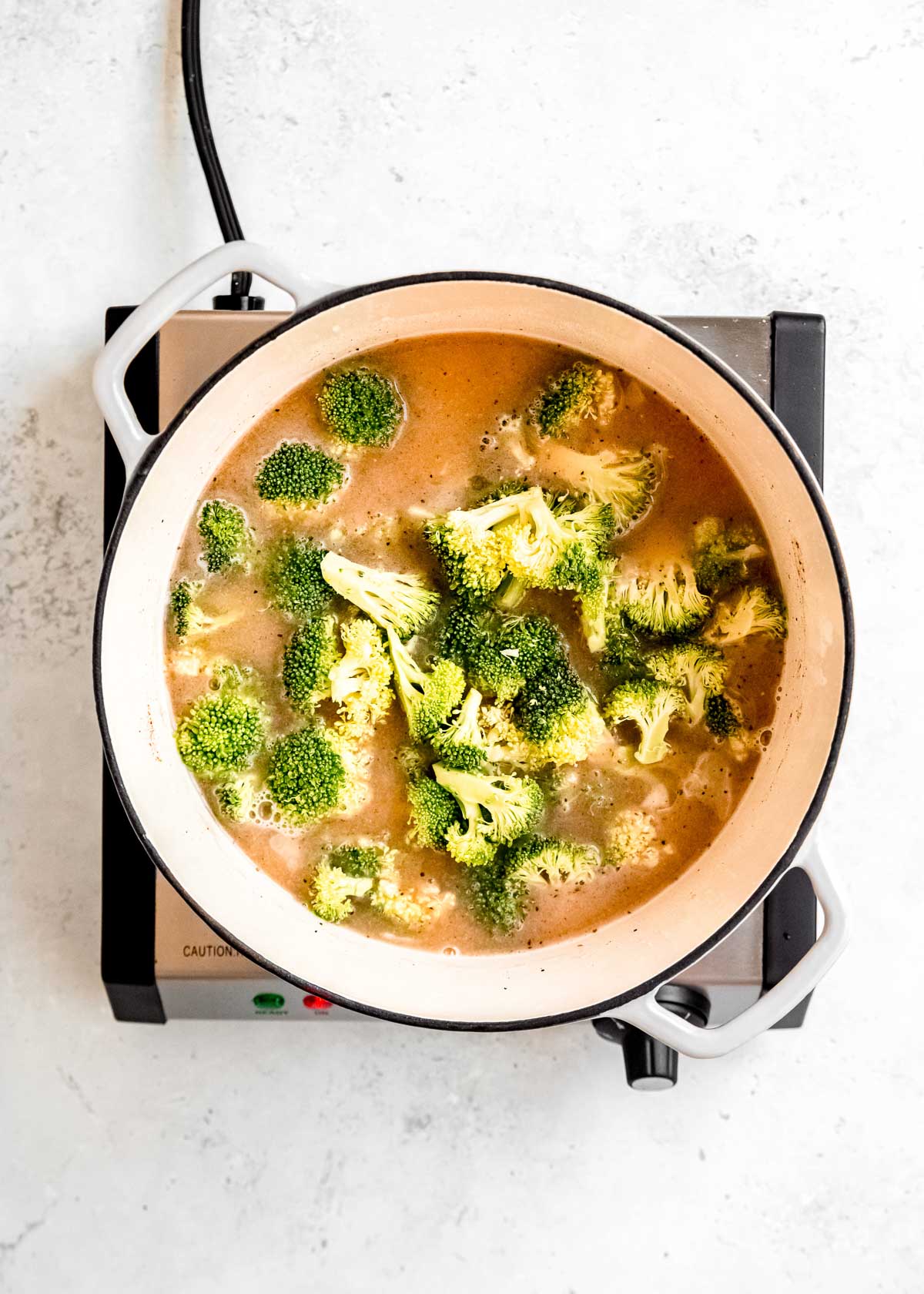 broccoli and broth in dutch oven