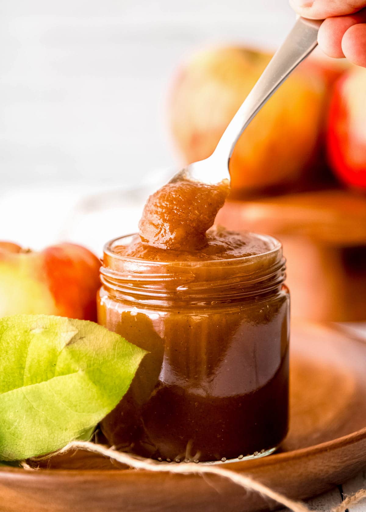 apple butter in jar with spoon