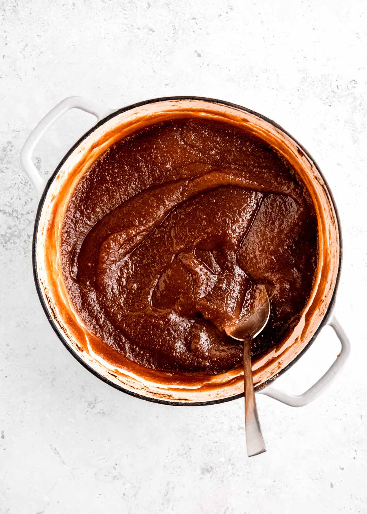 apple butter in pan with spoon