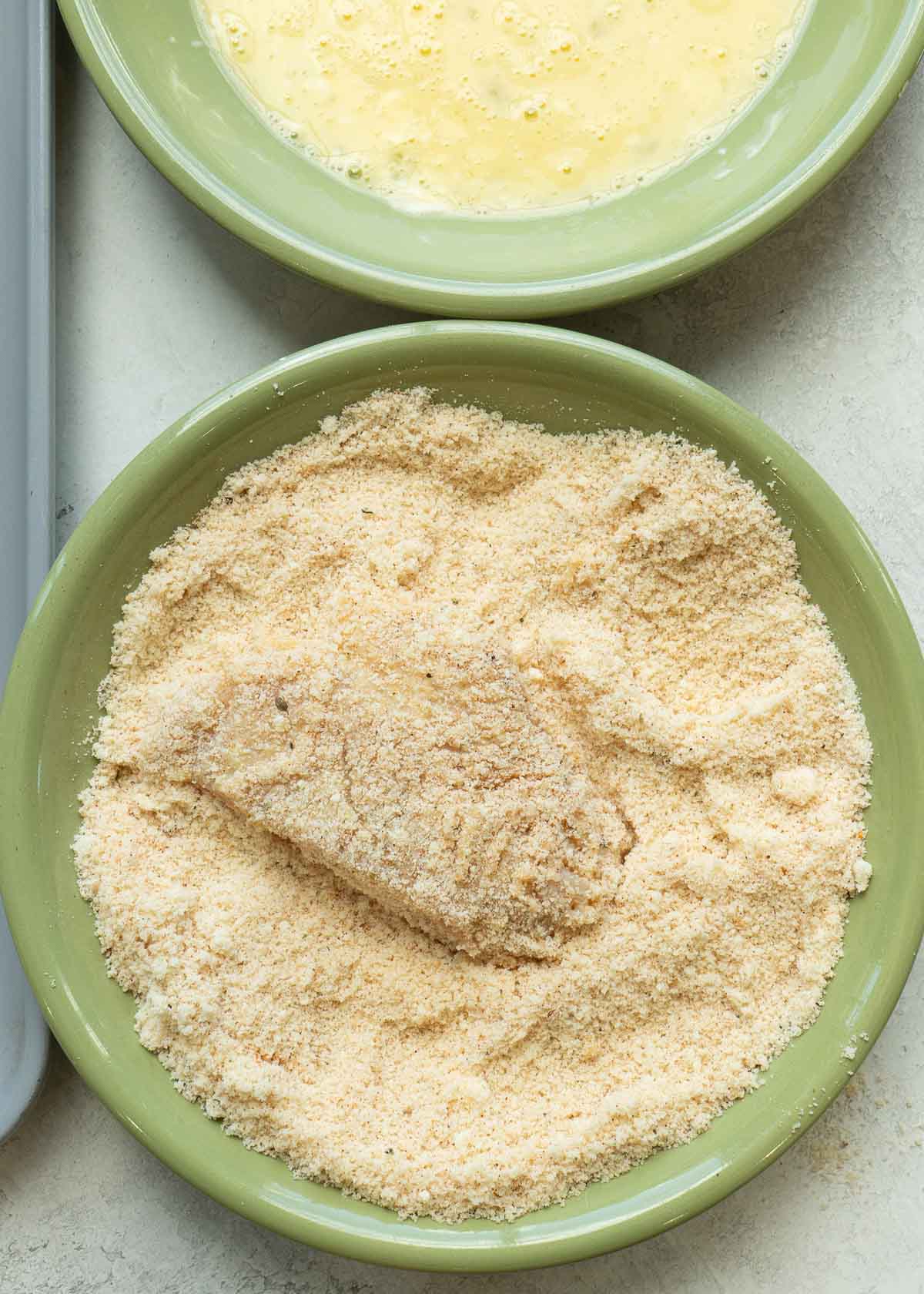 chicken tender in parmesan and almond flour mixture