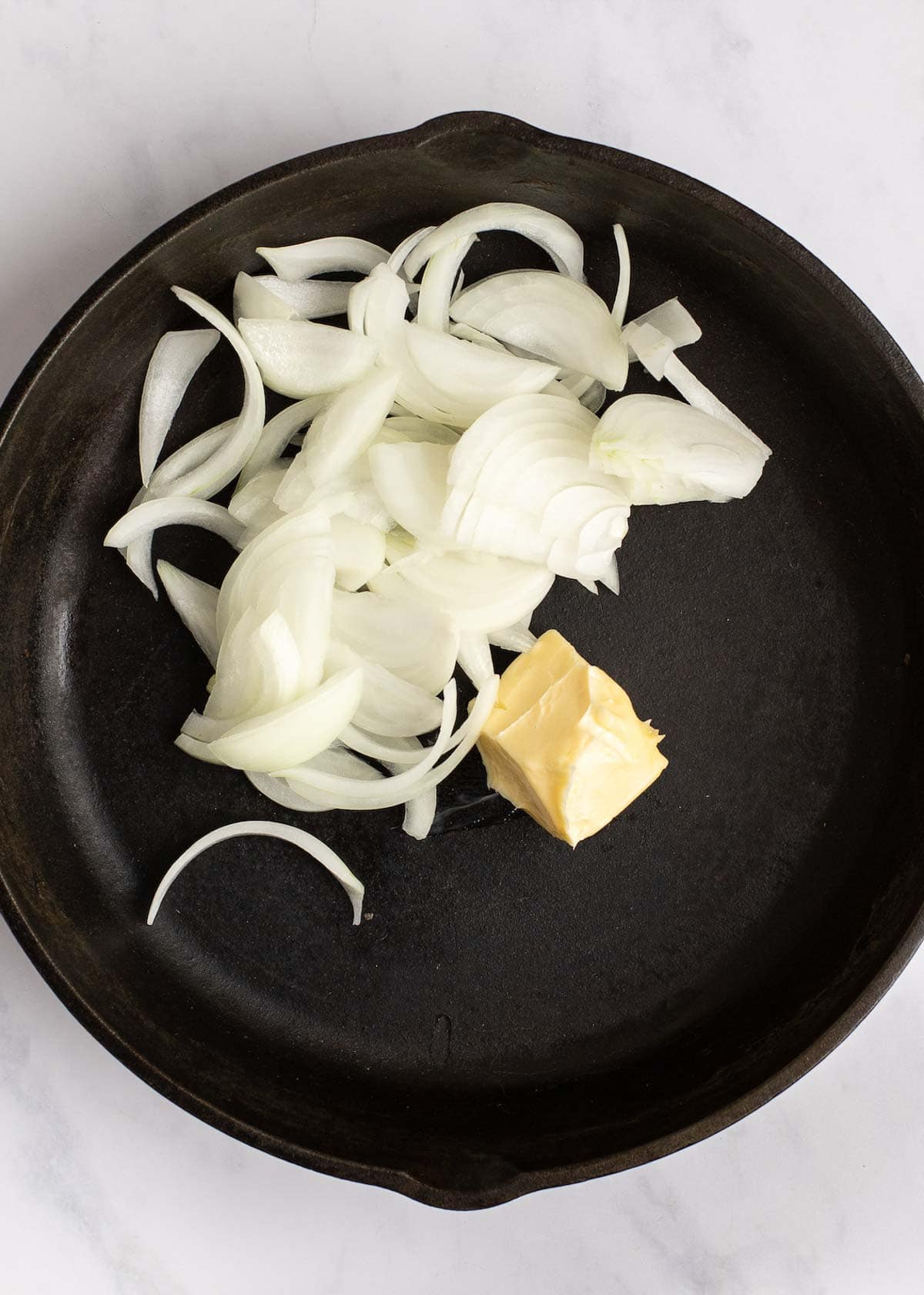 butter and onions in skillet