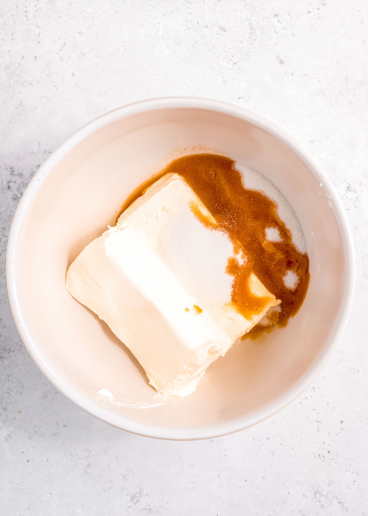 softened cream cheese, vanilla extract, and sugar in a bowl