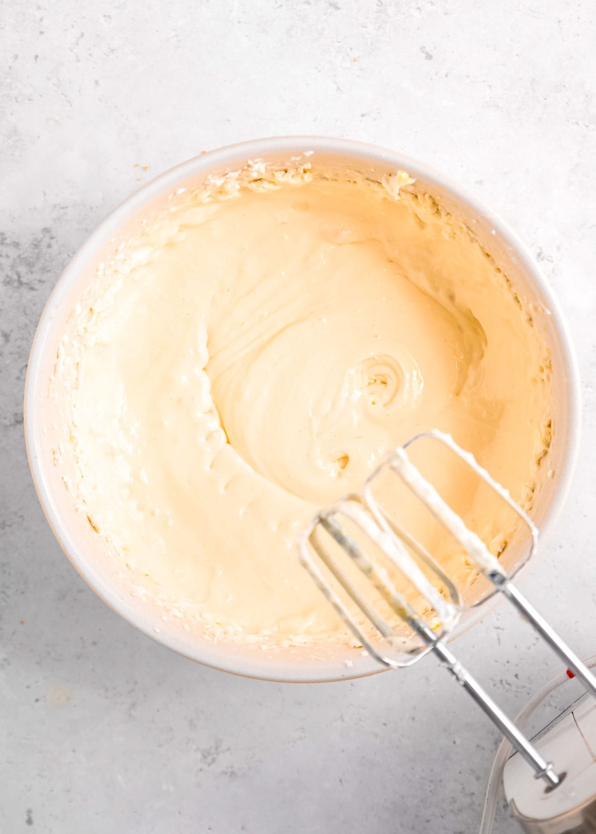 egg beaten into vanilla cheesecake mixture
