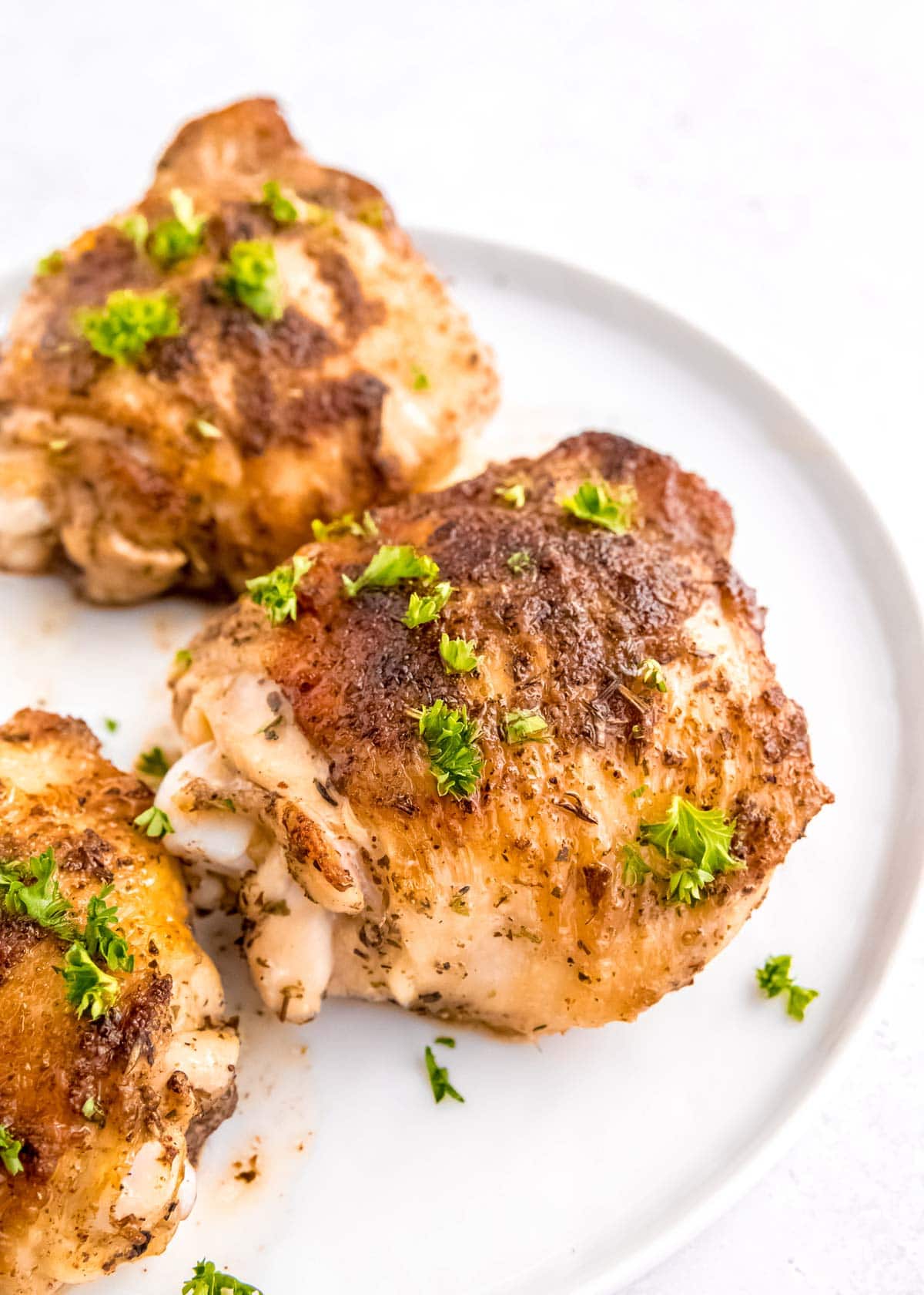 Instant Pot Chicken Thighs on white plate