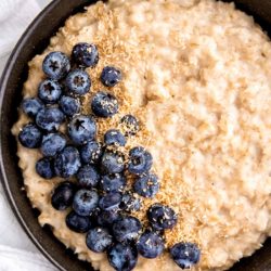 instant pot oatmeal and blueberries in a black bowl
