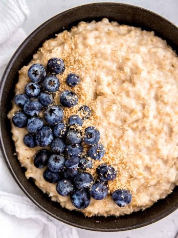 instant pot oatmeal and blueberries in a black bowl