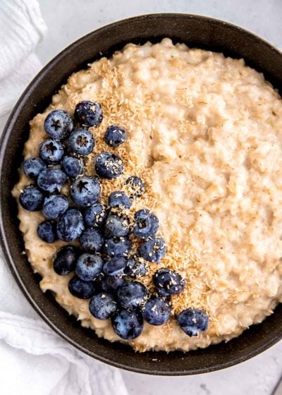 instant pot oatmeal and blueberries in a black bowl