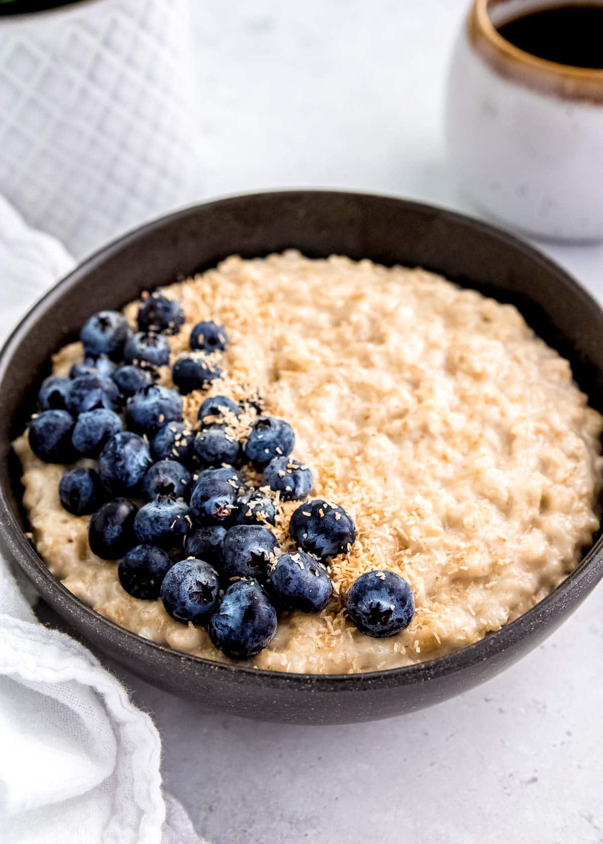 close up of instant pot oatmeal in black bowl