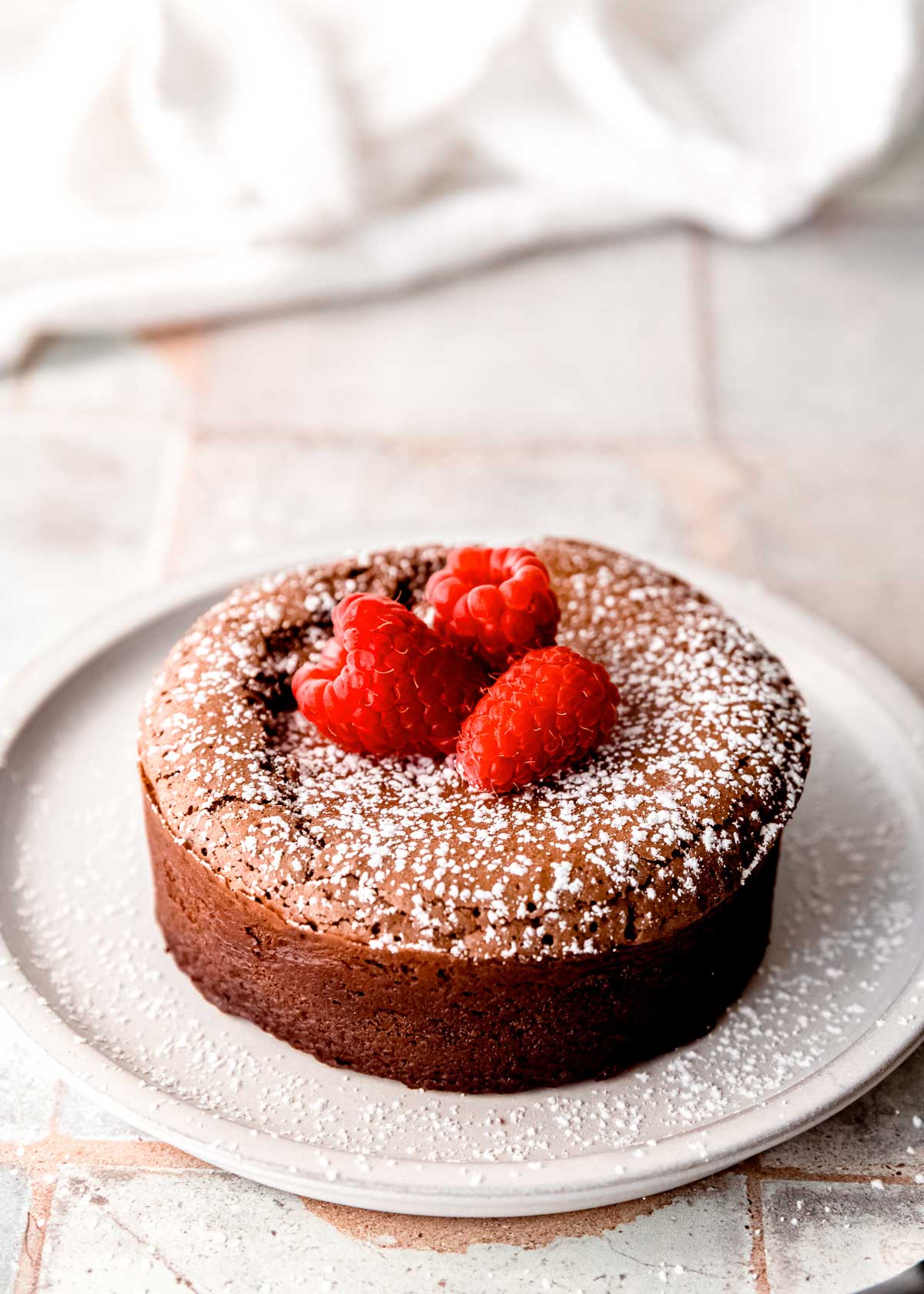 This easy Chocolate Lava Cake is the best dessert for two! This gluten-free chocolate cake has a gooey, melted center sure to make a great impression.