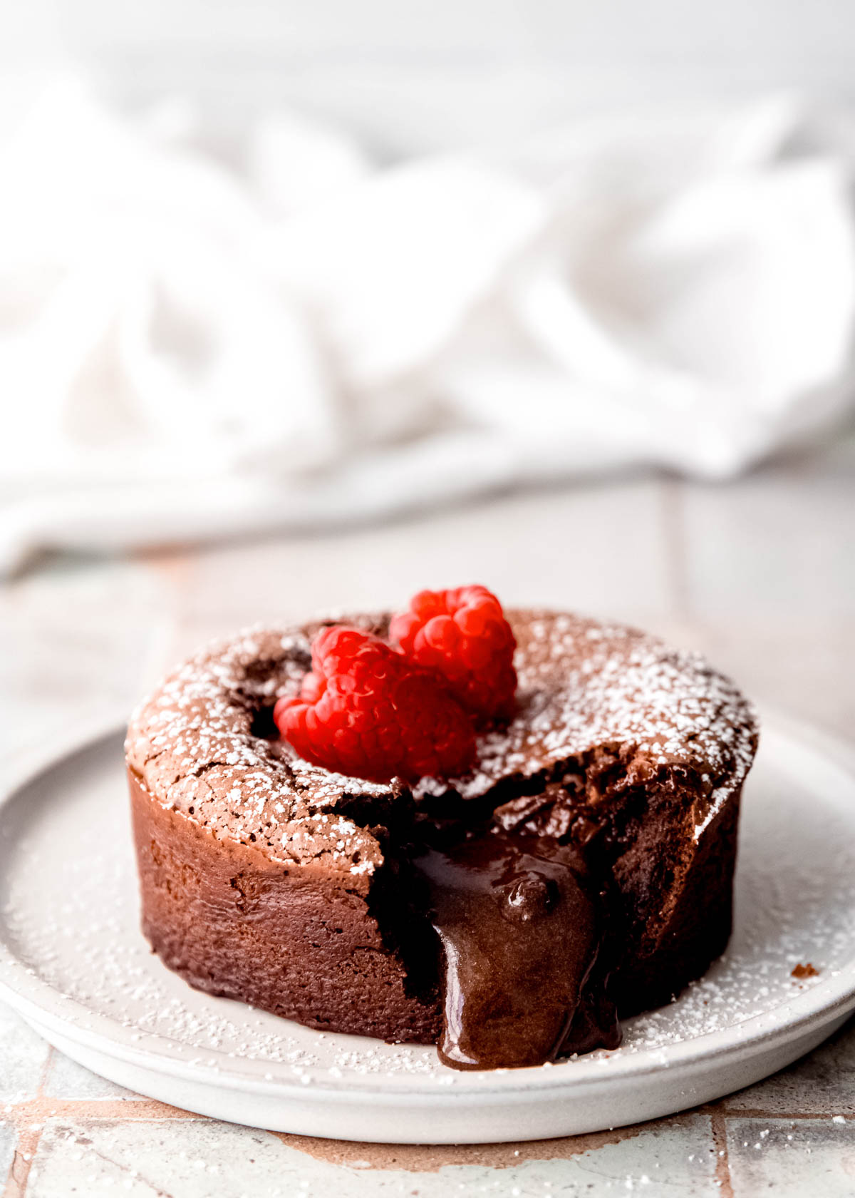 This easy Chocolate Lava Cake is the best dessert for two! This gluten-free chocolate cake has a gooey, melted center sure to make a great impression.