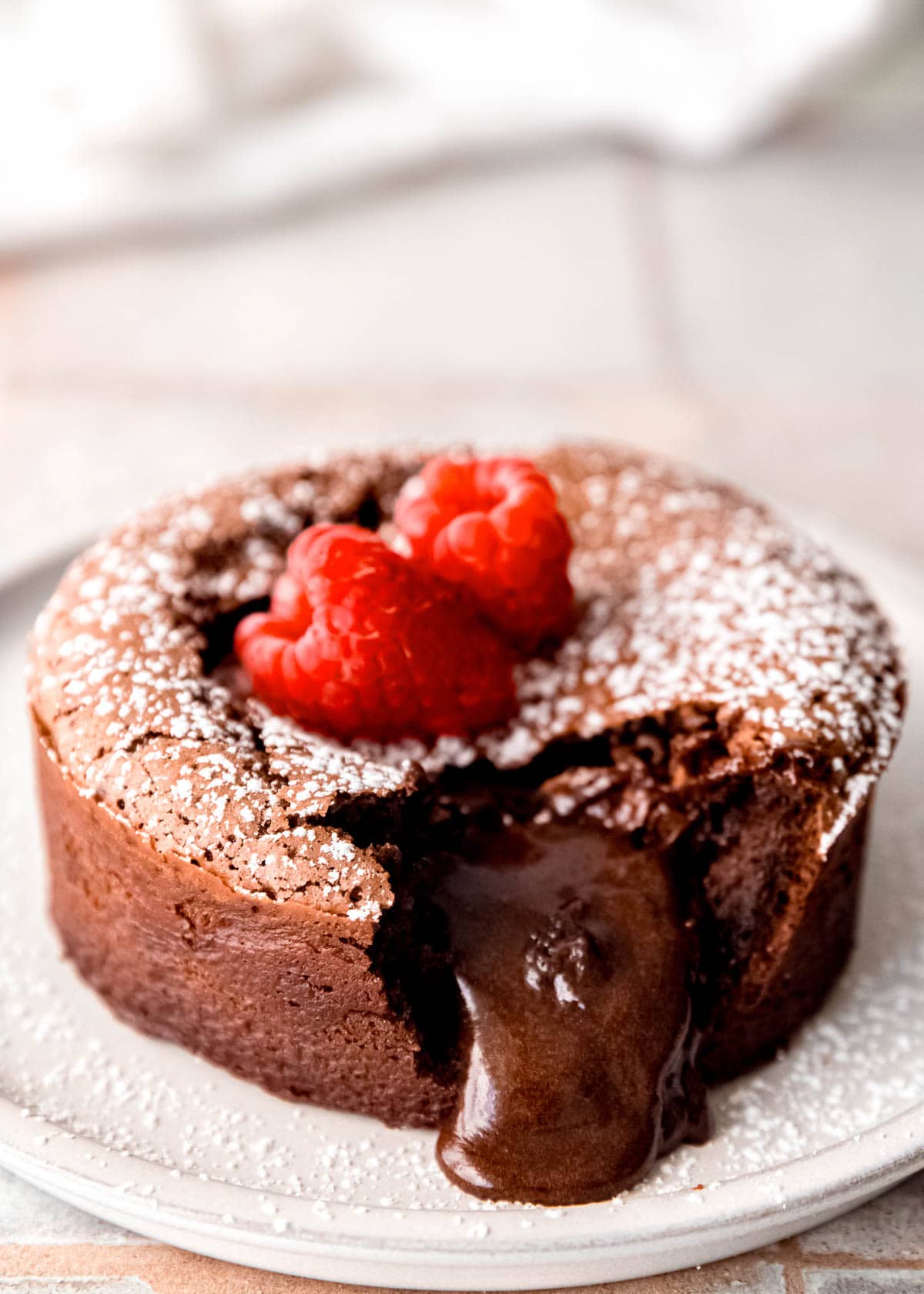 This easy Chocolate Lava Cake is the best dessert for two! This gluten-free chocolate cake has a gooey, melted center sure to make a great impression.