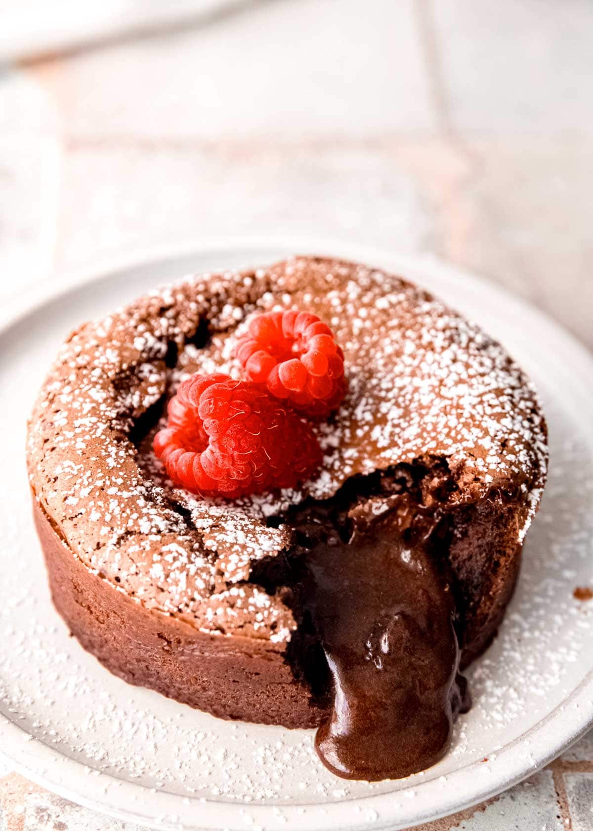 gooey chocolate spilling out of molten lava cake