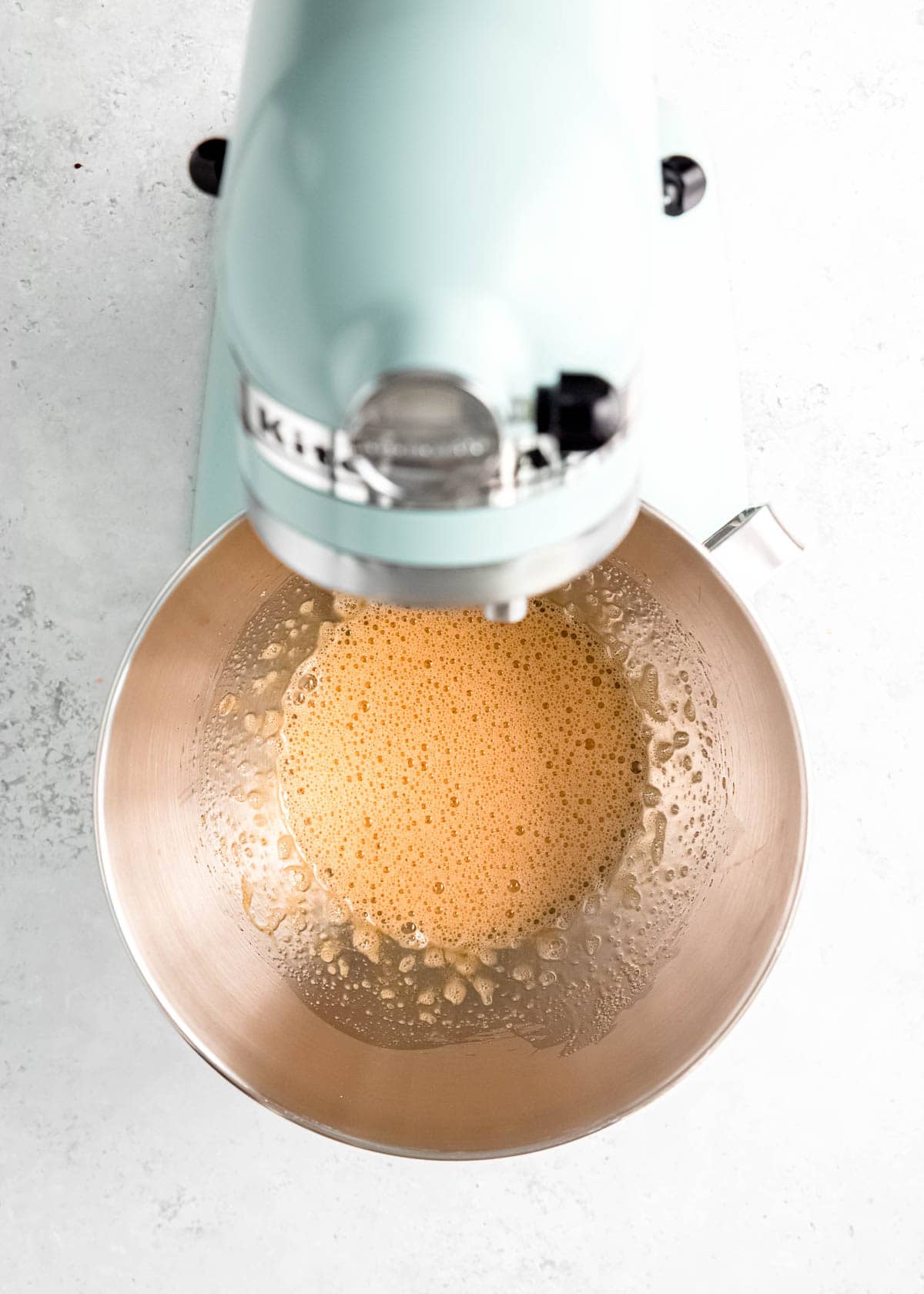 light, fluffy egg mixture in stand mixer bowl