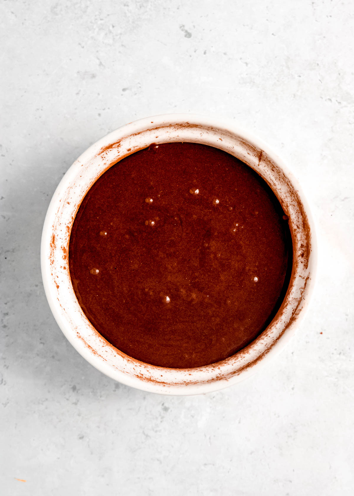 cake batter in prepared ramekin