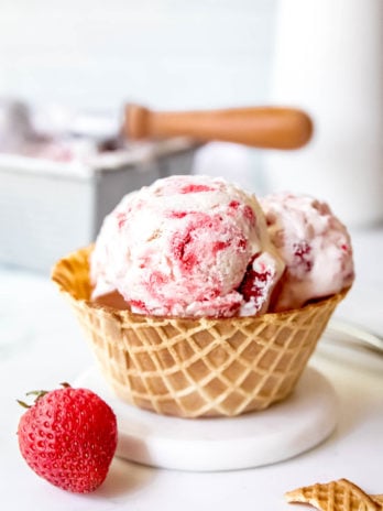 a waffle bowl full of homemade strawberry ice cream