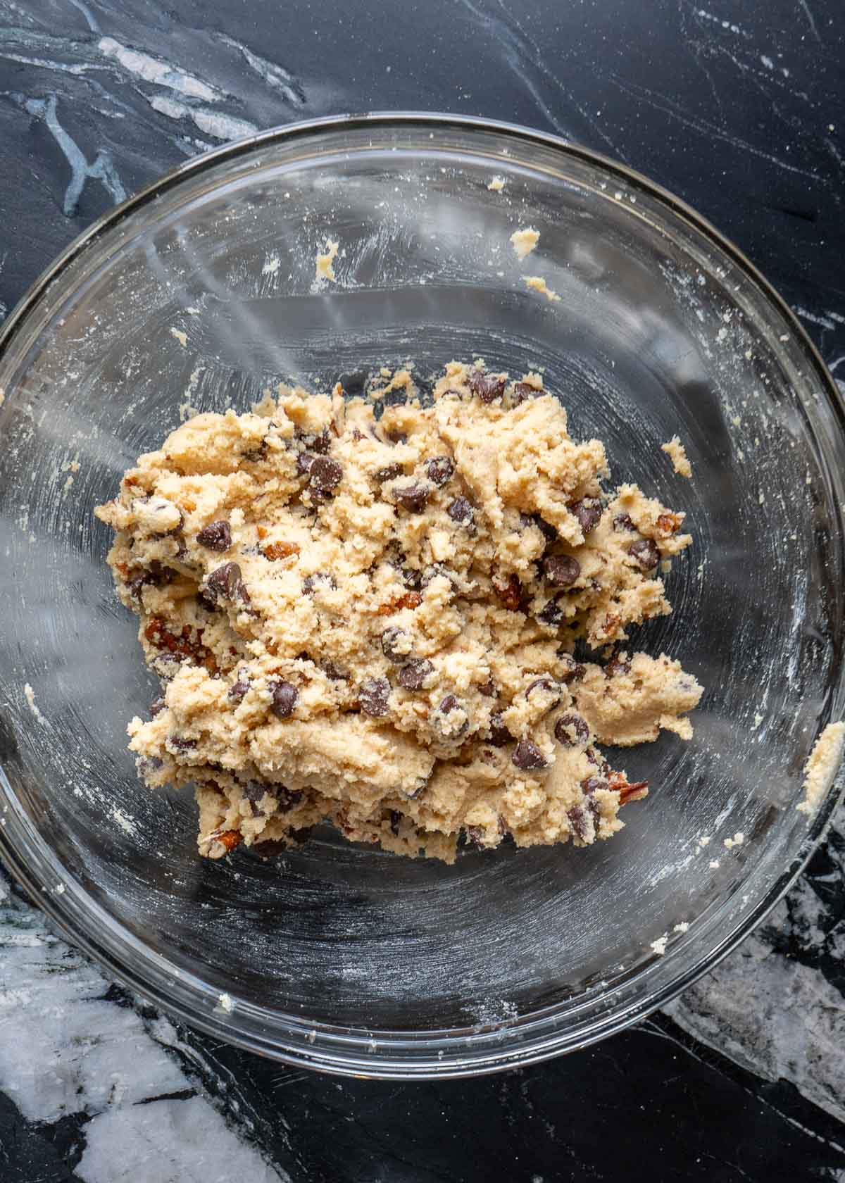 chocolate chips and pecans mixed into the keto cookie dough