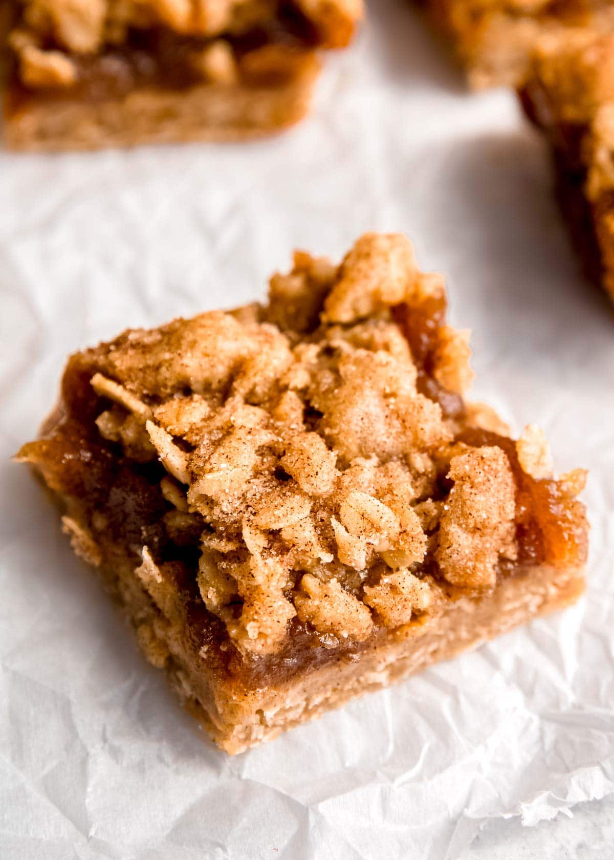 apple butter crumble bar on parchment paper