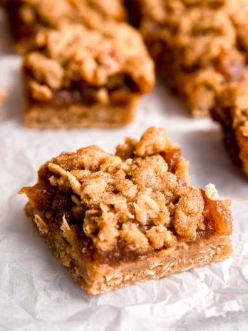 sliced apple butter bars on parchment paper