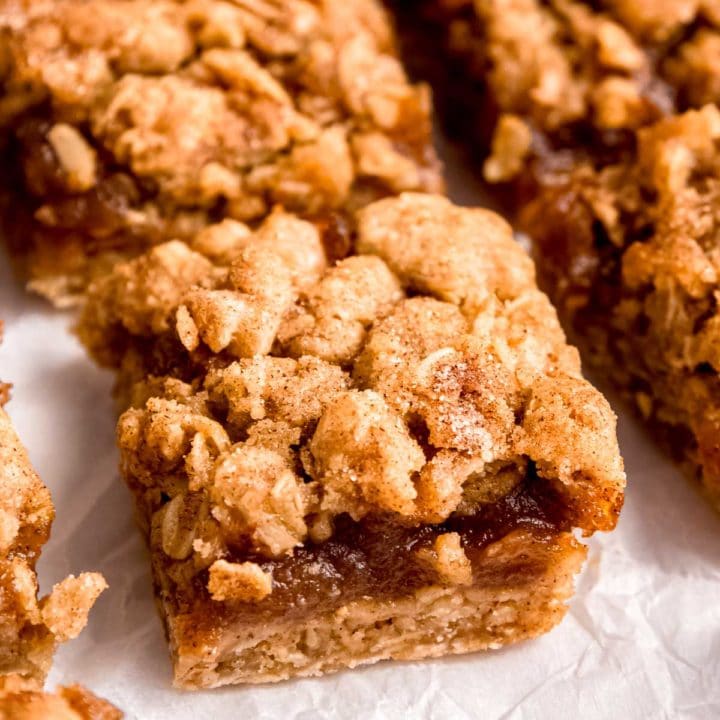 sliced apple butter bars on parchment paper