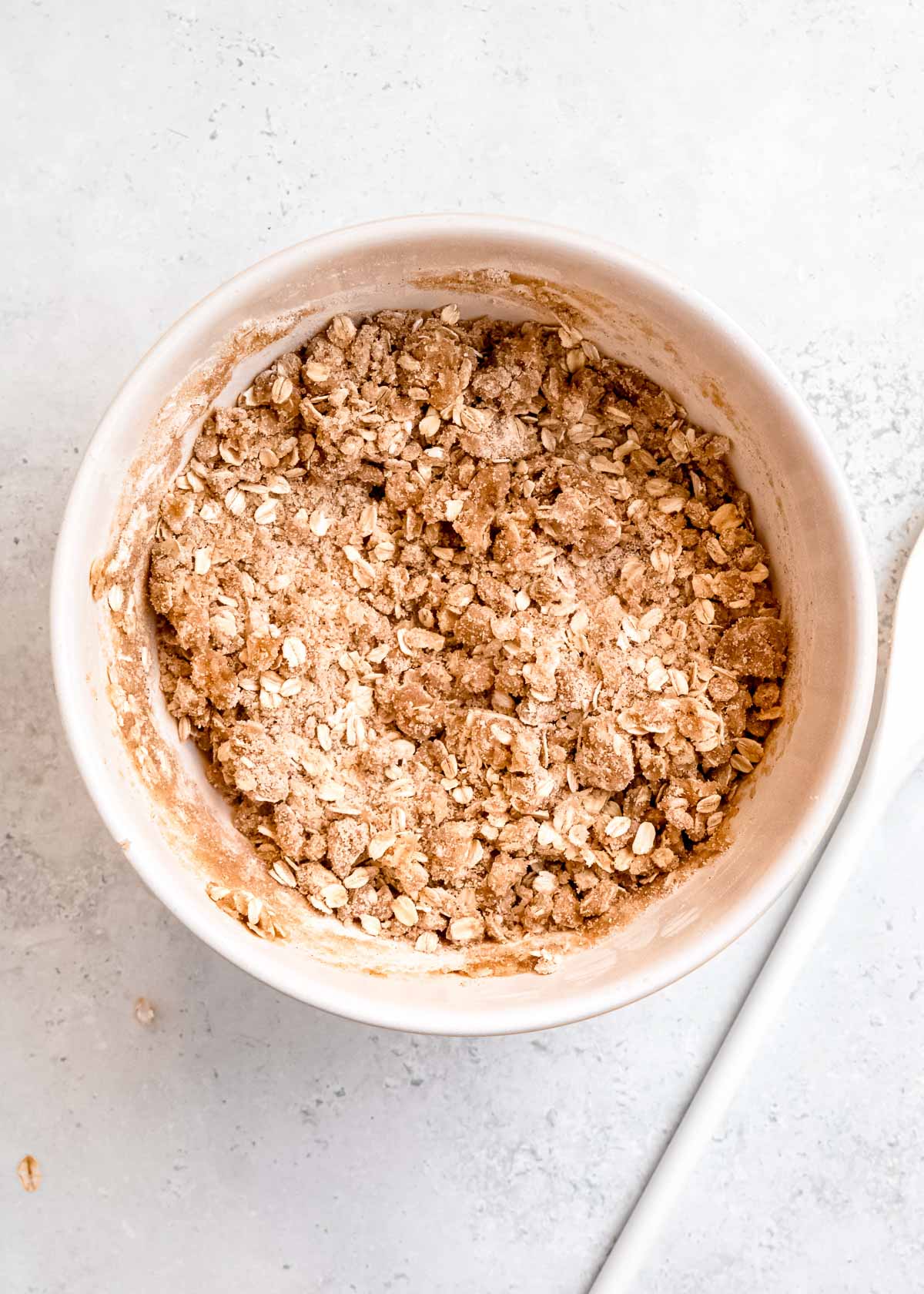 butter mixed into dry ingredients in a bowl