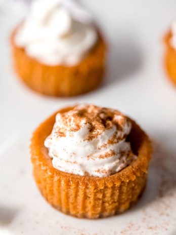 mini pumpkin cheesecake on a white plate