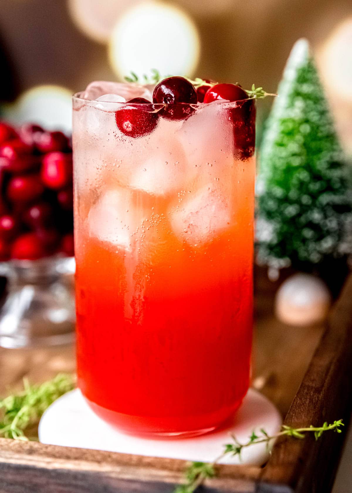 cranberry and thyme in a christmas aperol spritz