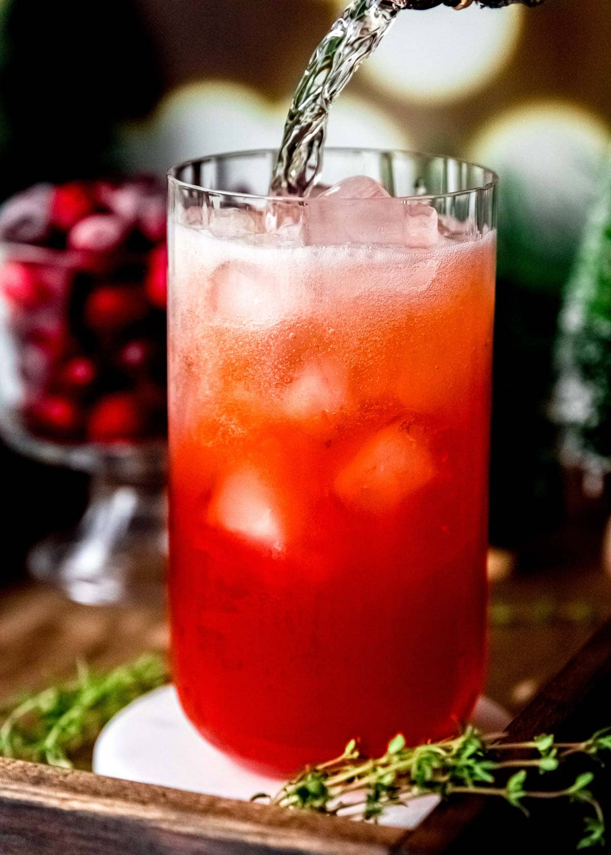 cranberry spritz topped with prosecco