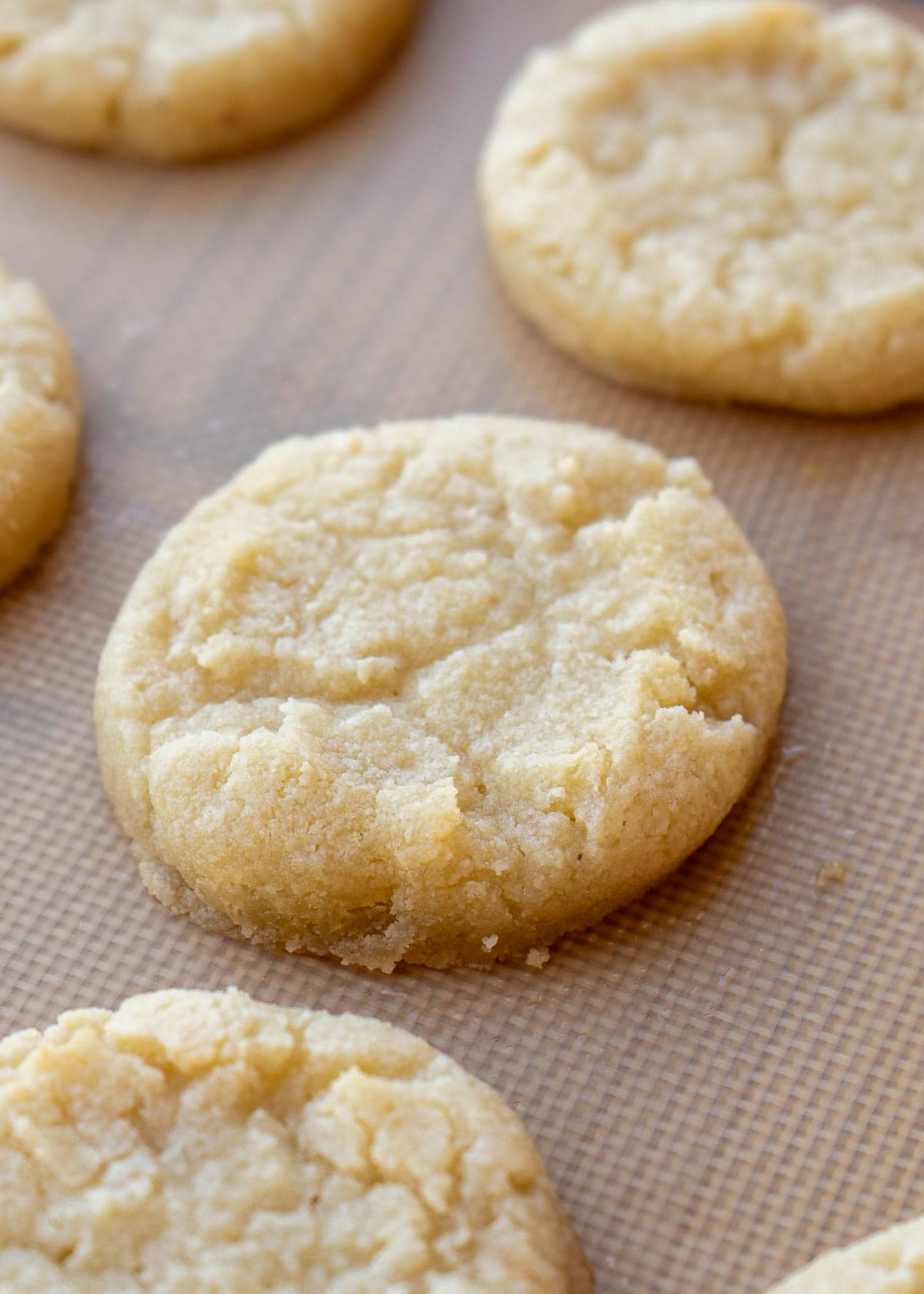 keto sugar cookies on a silicone lined baking sheet