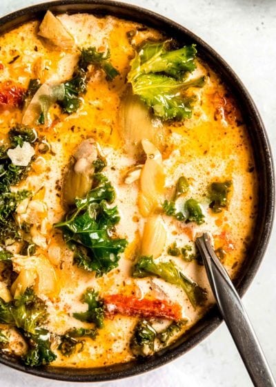 tuscan chicken soup in a black bowl