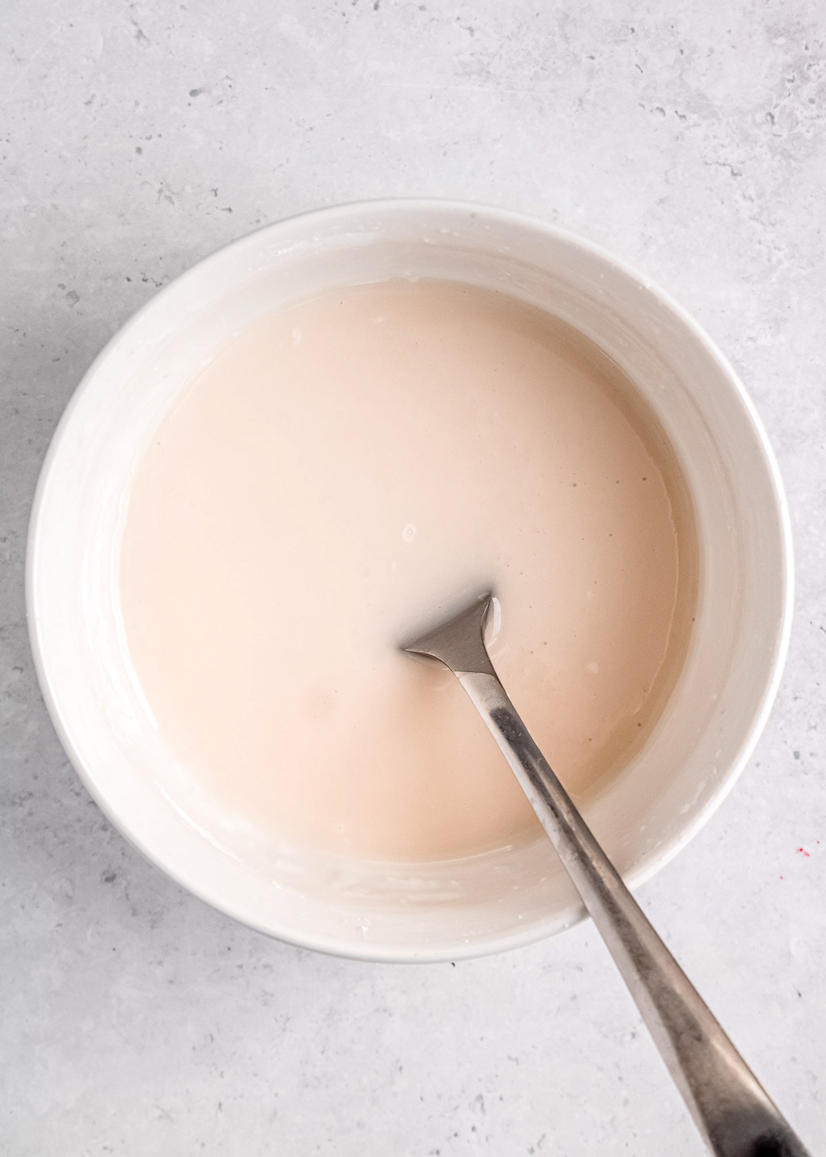 powdered sugar, cold water, and vanilla extract mixed into a glaze for cookies