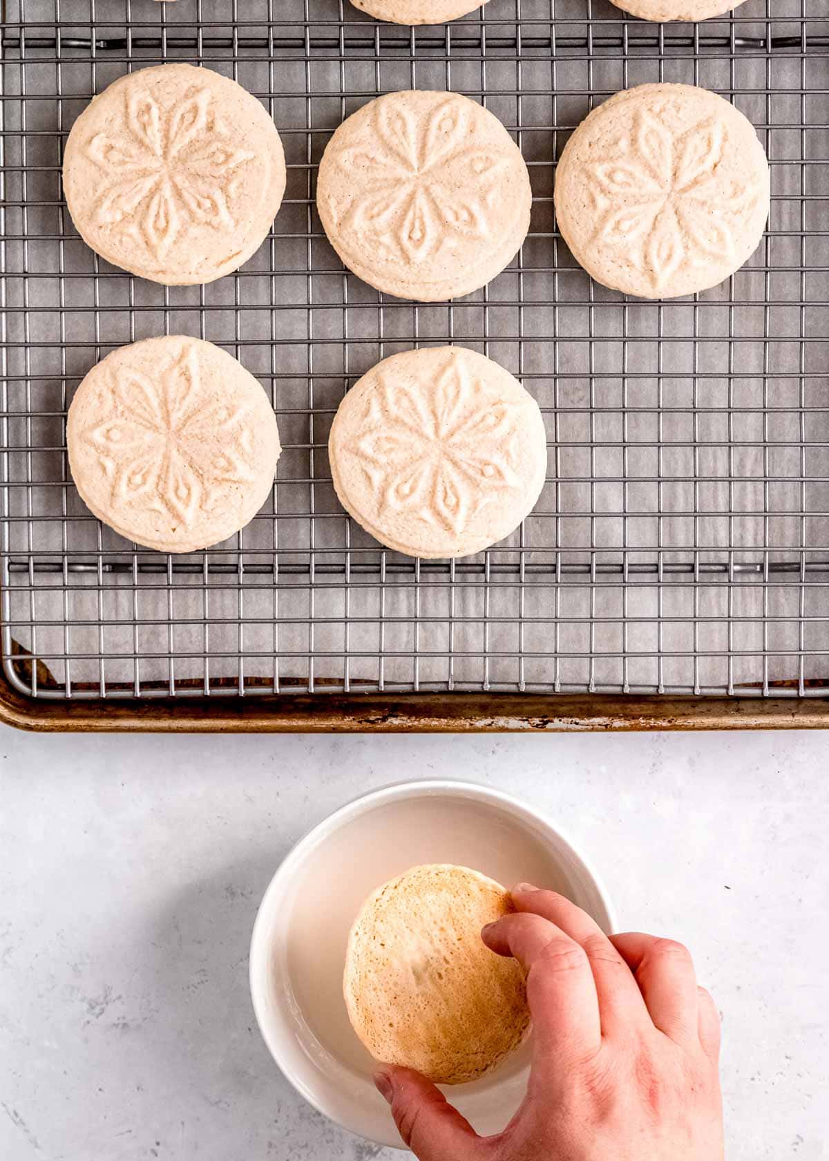 dip cookies face down, then place on a baking rack.