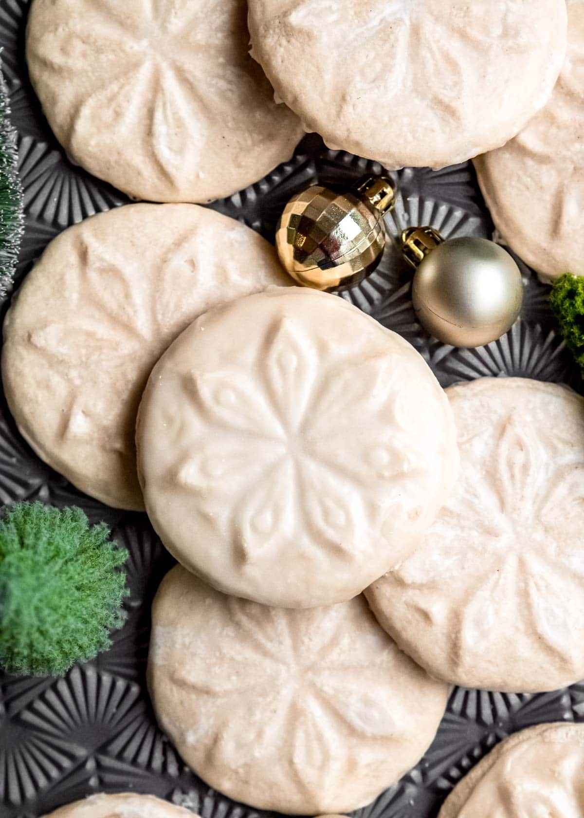 stamped gluten-free cookies on a table with jingle bells