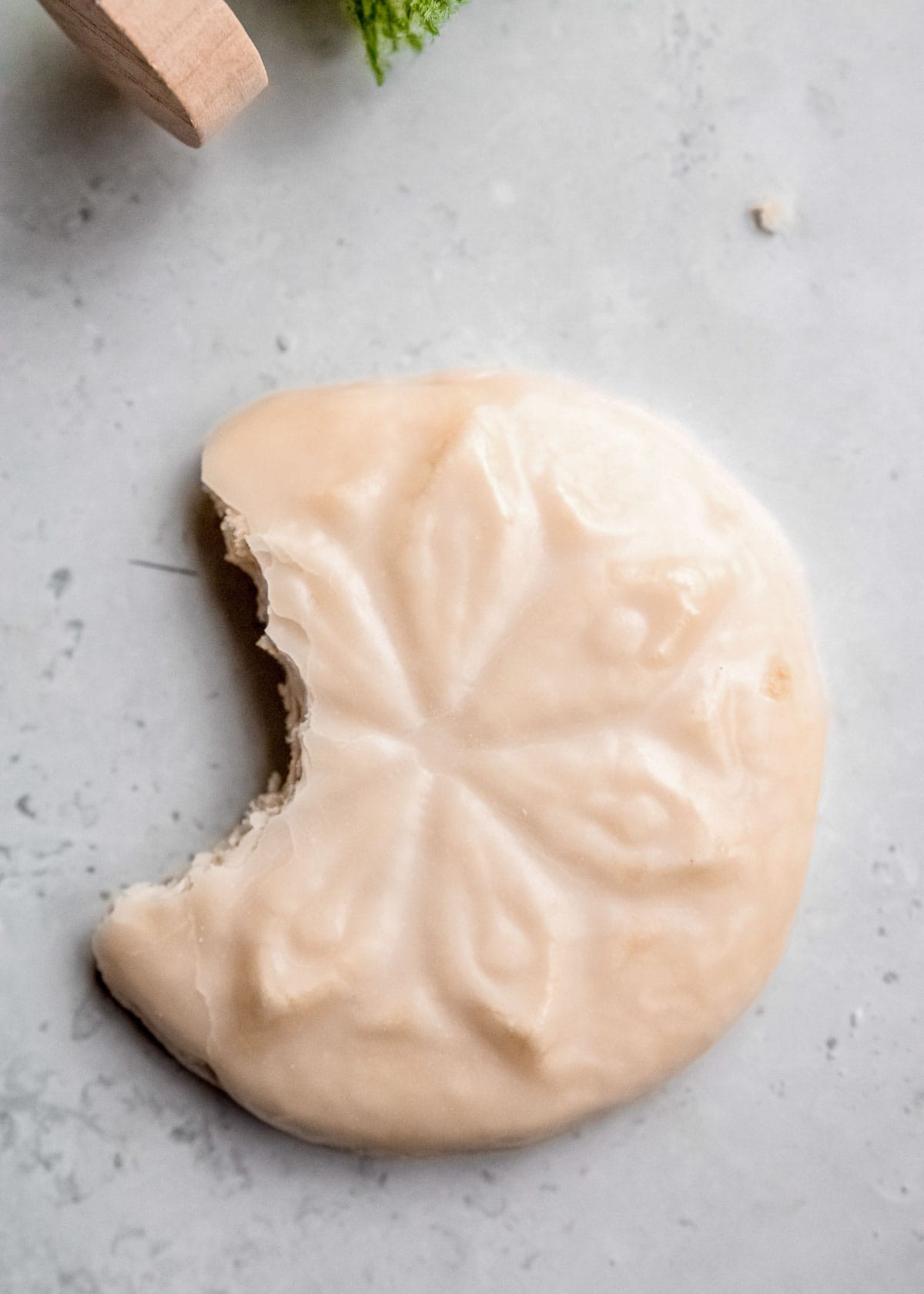 gluten-free sugar cookie with a bite taken out of it