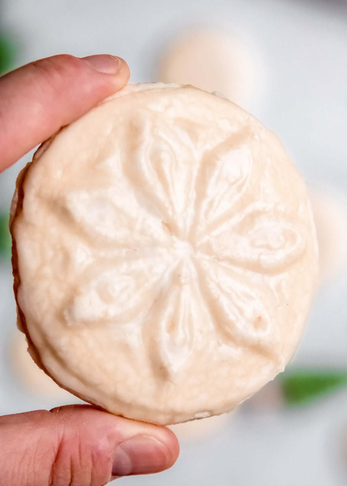 closeup of large, stamped gluten-free christmas cookie