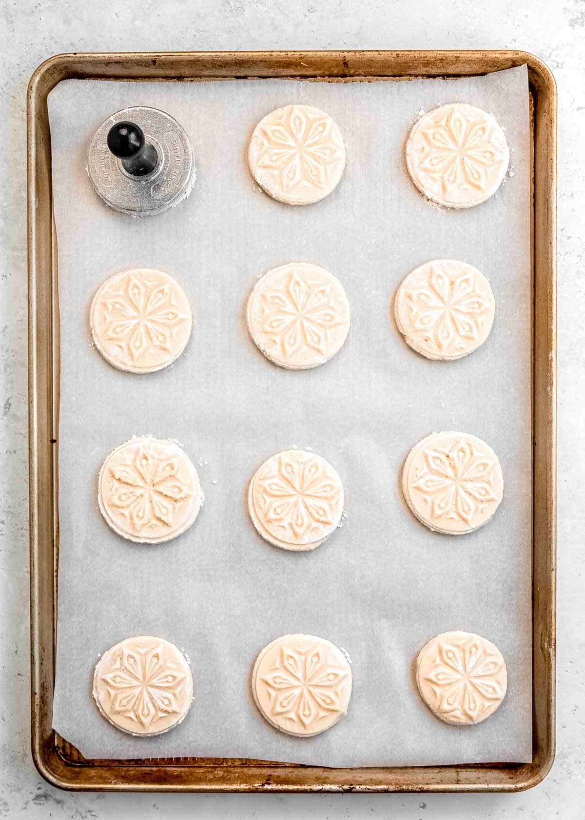 overhead shot of pan full of stamped cookie dough