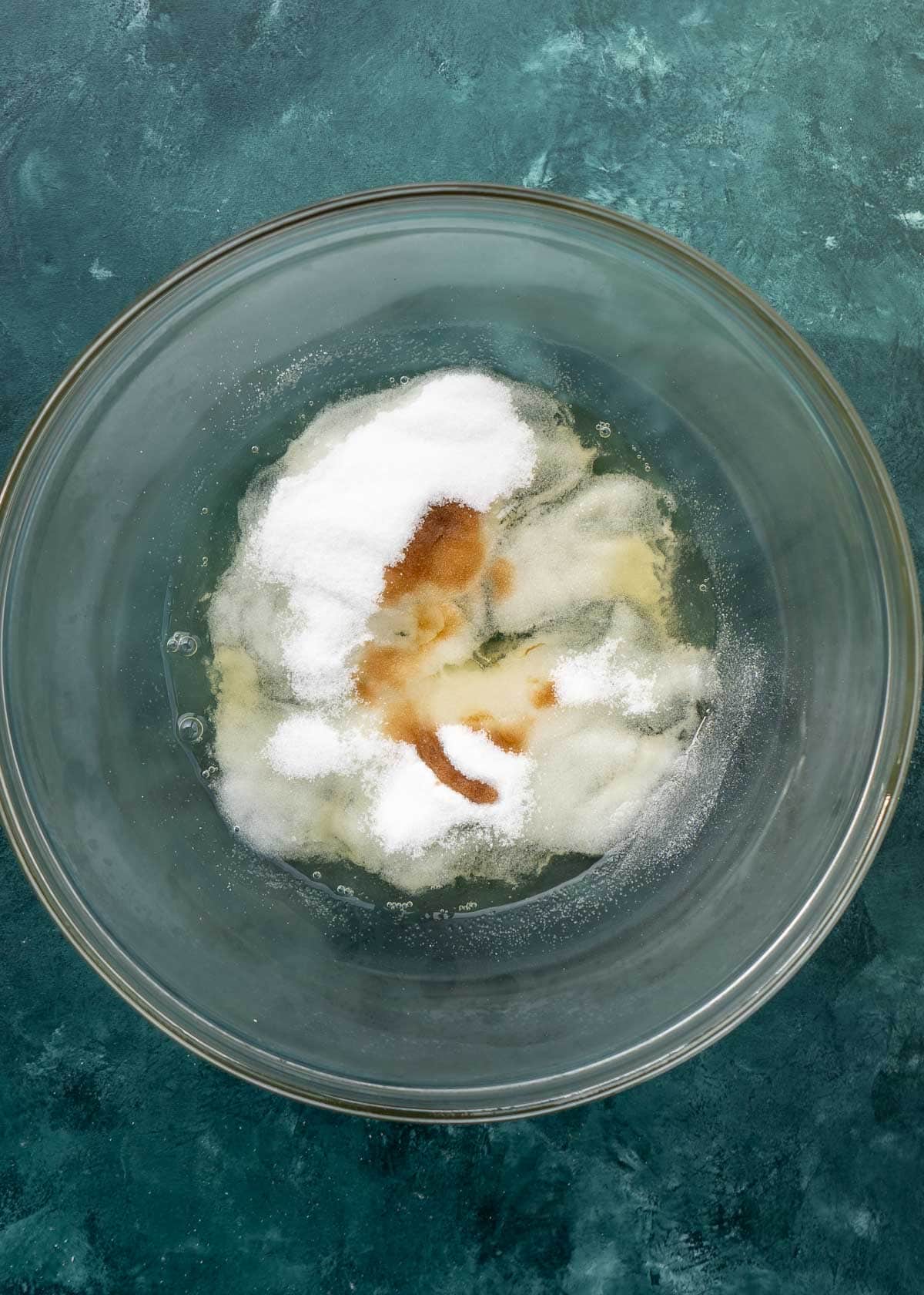 overhead shot of coconut macaroon ingredients in clear mixing bowl